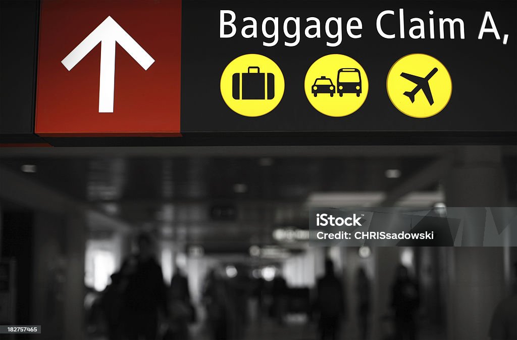 Baggage Claim Baggage Claim Sign at Airport. Part of Image Desaturated to Black and White Airplane Stock Photo