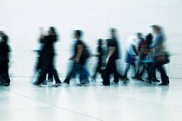 istock Group of Young People Walking Through Corridor 182758098
