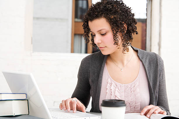 istock Woman at Work Using Laptop in Home or Office 182758695