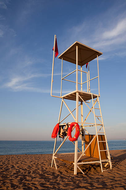 istock Lifeguard watch point tower on beach 182759072