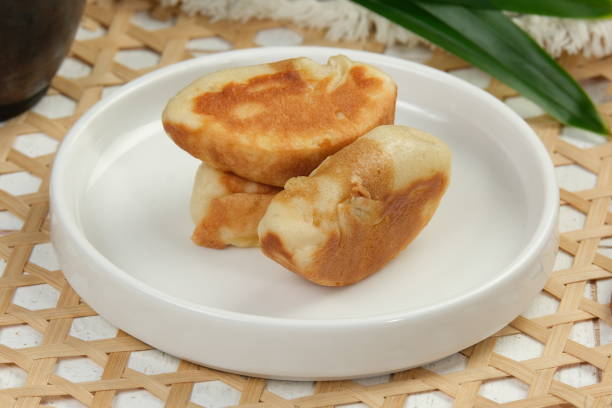 istock Kue Pukis or pukis cake , Traditional Javanese half-moon shaped pancakes. made from flour eggs yeast and coconut milk 1827591371