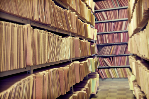 Archive shelves full of files