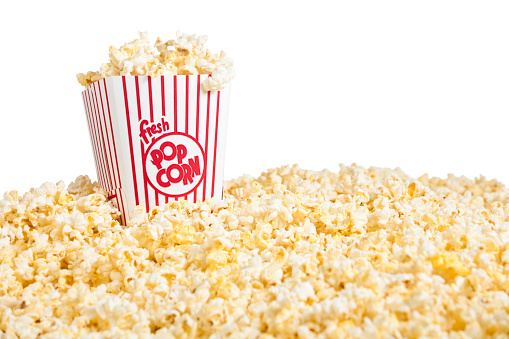 Movie Popcorn container and pile of popcornRelated Images: