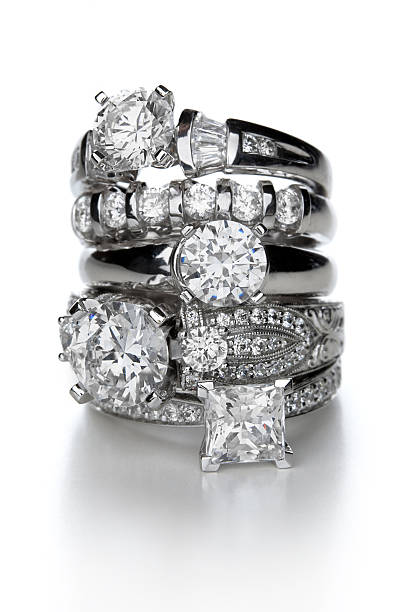 Diamond Rings A stack of diamond rings.Click the image for jewelry and gemstone photos: diamond ring stock pictures, royalty-free photos & images