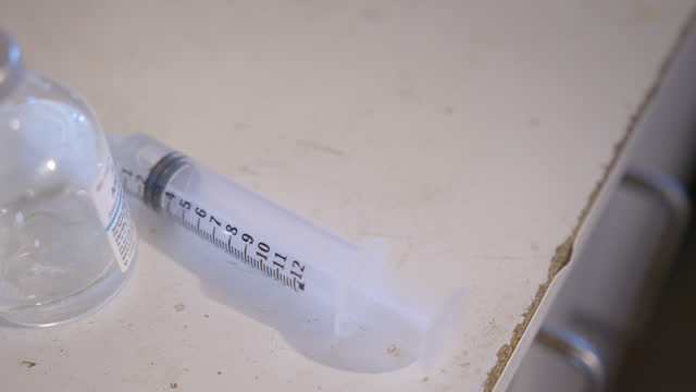 Close-Up of a Large Syringe Indoors