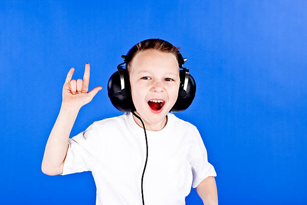 istock Little boy listening to rock and roll 182760514