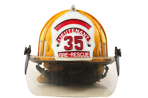 Yellow firefighter's helmet with firefighter shield with Lieutenant, 35 and Fire-Rescue on it.