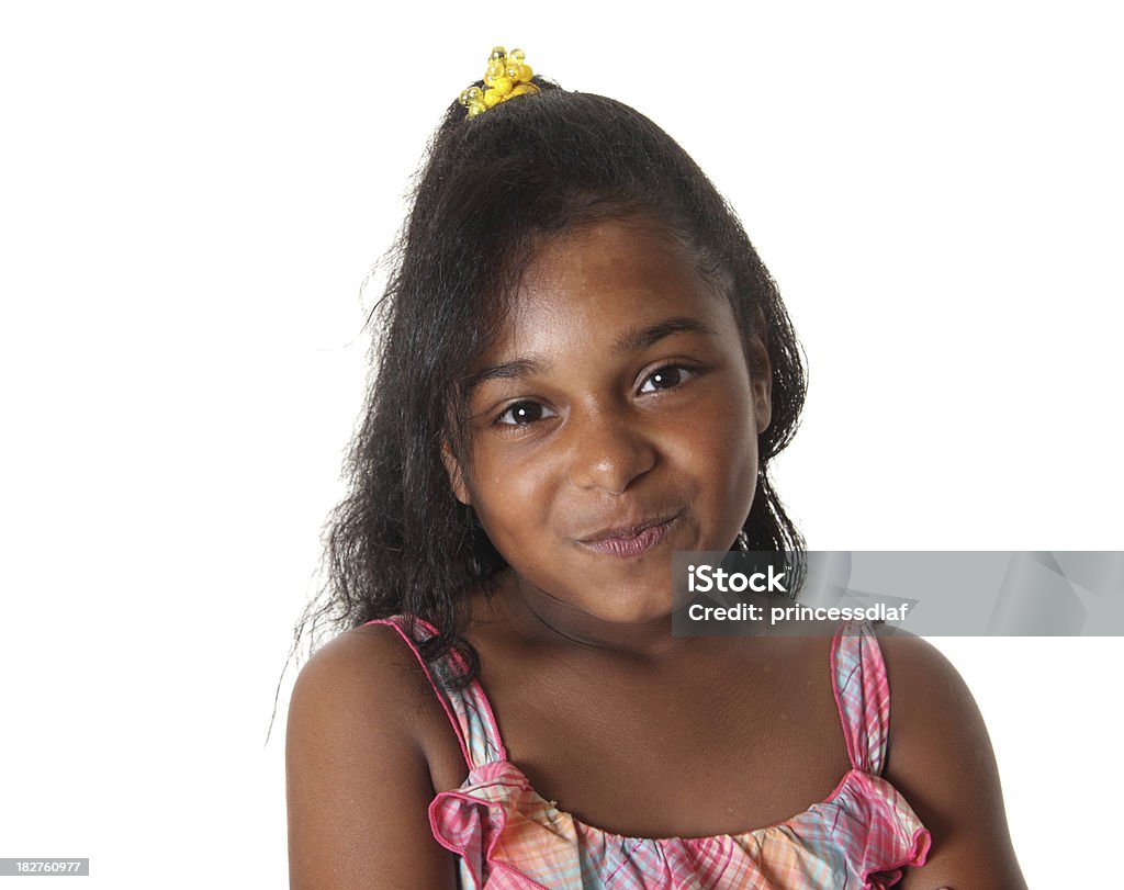 Trying Not to Laugh Cute little girl trying to hold in a laugh on a white background 8-9 Years Stock Photo
