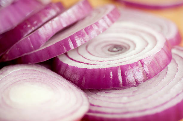 istock Sliced Spanish Onions on a Wooden Cutting Board 182760979