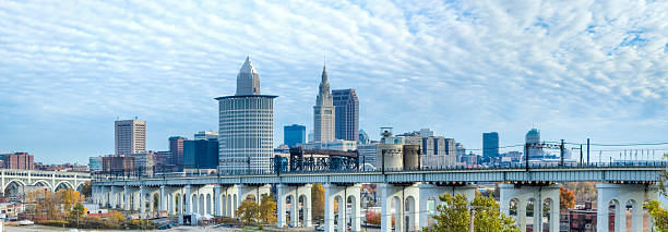 Cleveland Cityscape With Interesting Cloud Formations - Panorama Cleveland from the southwest looking northeast over the Cuyahoga River.I invite you to view some of my other Cleveland photos: cuyahoga river photos stock pictures, royalty-free photos & images