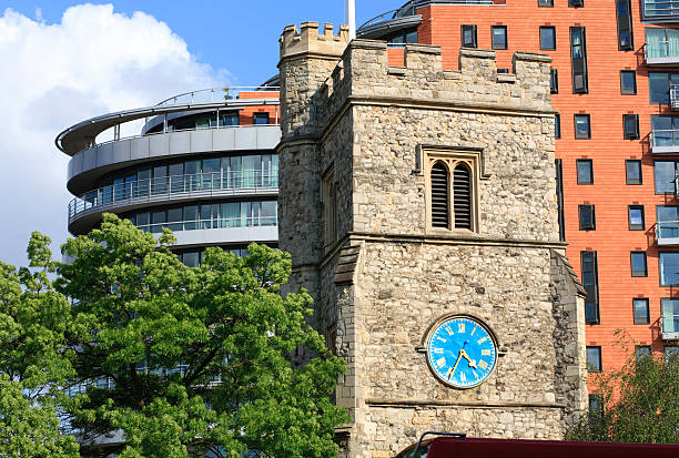 Church spire and contrasting apartment development "Parish Church of Saint Mary's Putney, London and modern Putney Wharf apartment development" putney photos stock pictures, royalty-free photos & images