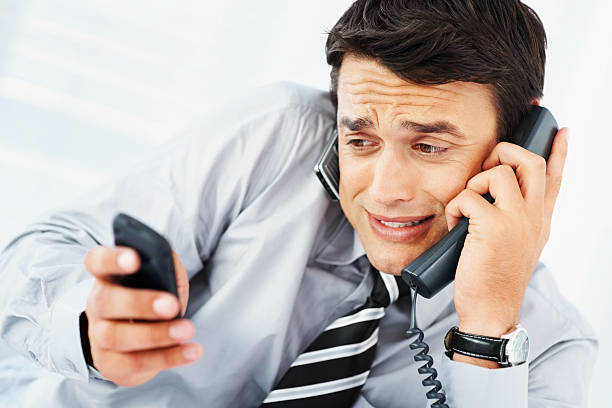 istock Busy business man attending many phone calls simultaneously 182762041