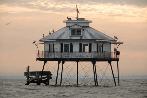 Middle Bay Lighthouse in Mobile Bay in Alabama.  Only accessible by boat.  Taken at sunrise.