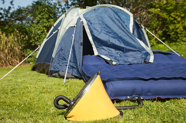 Airbed Foot Pump A footpump inserted into a camping airbed ready for inflation - focus on the pump.Related images in my portfolio: air pump stock pictures, royalty-free photos & images