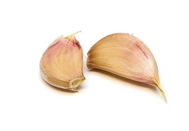 istock Garlic Cloves Against A White Background. 182765233