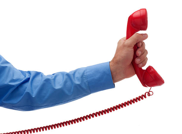 istock Holding Out a Red Phone on White 182765685