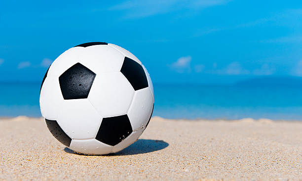 istock Football on a tropical beach 182766499