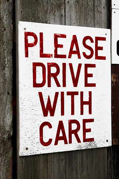 istock 'Please Drive With Care' sign 182766810