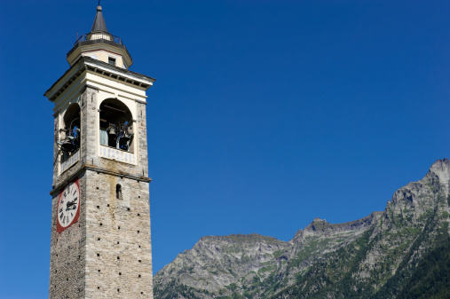 The bell tower of the saint michael church build during the 15th century. premia municipality. piemonte. italy.