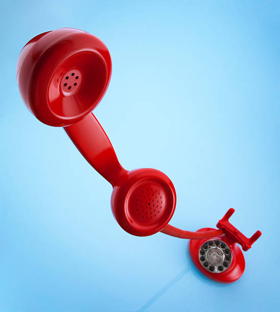 istock Red Old Fashioned Telephone on a Blue Background 182767453