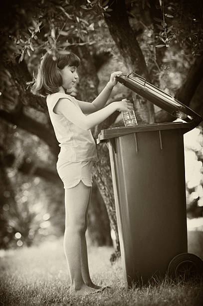 istock Young Girl Throwing Away a Bottle 182767609