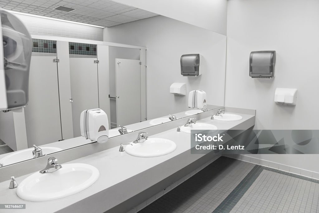 An empty commercial/public restroom A public restroom's sinks. Public Restroom Stock Photo