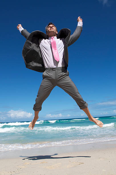 istock Businessman Does Ecstatic Leap into the Air 182769101