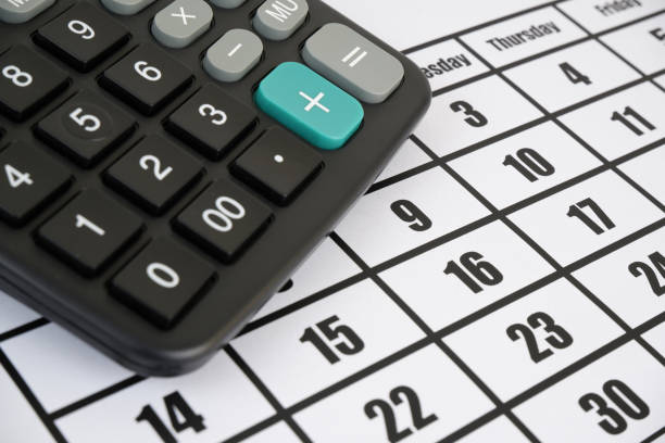 istock Black calculator on calendar page 1827694618