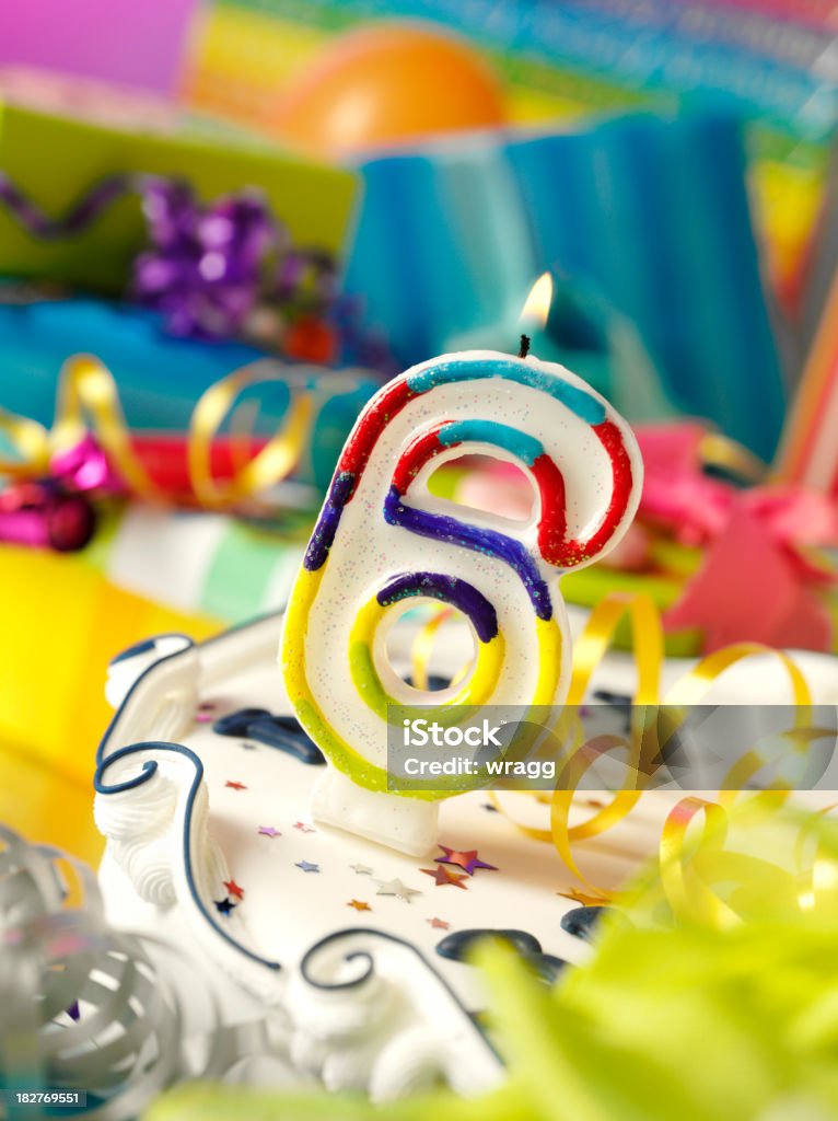 Number Six Birthday Candle Number six birthday candle with differential focus on the gifts.Click on the link below to see more of my party and wedding images Birthday Stock Photo