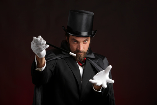 Magician performing tricks with a magic wand