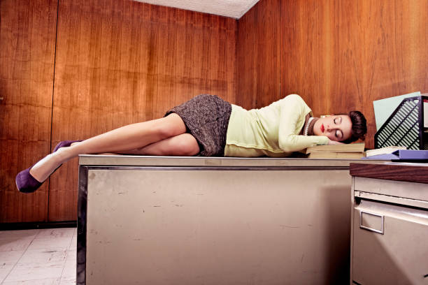 Secretary Sleeping on Desk. Retro Office and styling