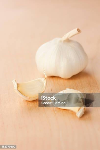 Garlic Head With Two Gloves Stock Photo - Download Image Now - Clove - Spice, Color Image, Concepts