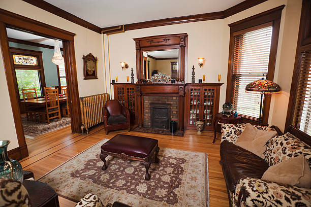 Dining and Living Room of a Traditional Victorian Style Home Dining room and living room of a restored and renovated traditional Victorian style home. victorian dining room stock pictures, royalty-free photos & images