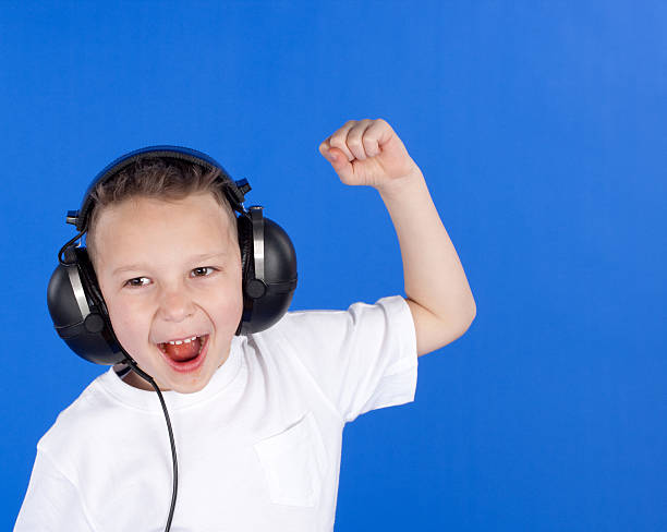 istock Child wearing headphones 182771167