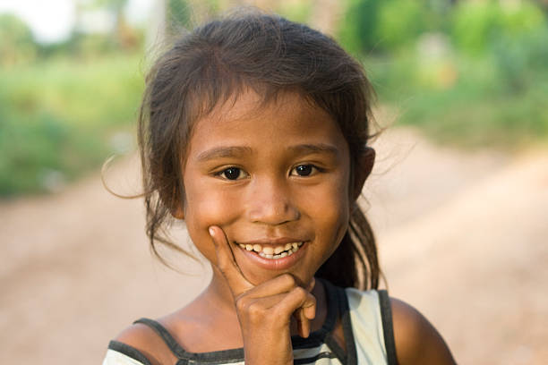 Happy Cambodian children in village near Siem Reap, Cambodia. Sampeah is a Cambodian greeting and it's similar to Indian namaste.