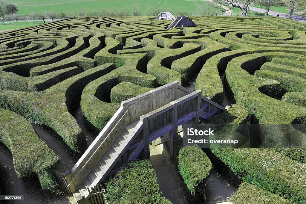 Maze with Bridges Bridges offer solutions through a maze of clipped topiary hedgesEngland Maze Stock Photo