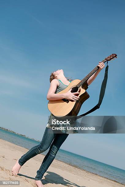 Teen Playing Guitar Outside Stock Photo - Download Image Now - 14-15 Years, Acoustic Guitar, Activity
