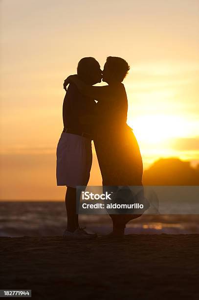 Romantic Senior Couple Kissing Stock Photo - Download Image Now - In Silhouette, Kissing, Senior Couple