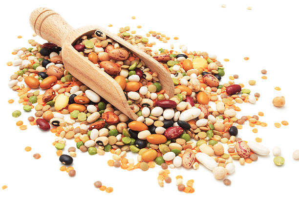 istock Different legumes and beans spilled around a wooden scoop 182772406