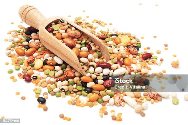 Different Legumes And Beans Spilled Around A Wooden Scoop Stock Photo - Download Image Now