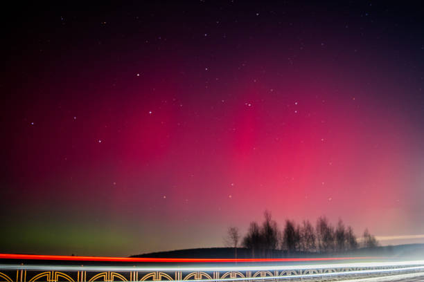 The Northern Lights are red. Rethinking the northern Lights using other colors. A rare image of the red Aurora borealis (Northern Lights). The Northern Lights are red. Rethinking the northern Lights using other colors. A rare image of the red Aurora borealis (Northern Lights). Selective focus. aurora borealis orange stock pictures, royalty-free photos & images