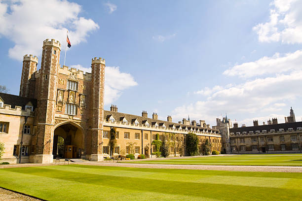 Trinity College Cambridge "Trinity College, Cambridge is one of the constituent colleges of Cambridge University. Trinity College was founded by Henry VIII in 1546. Most of Trinityaas major buildings date from the 16th and 17th centuries. Seen here is the quadrangle known as The Great Court and reputed to be the largest enclosed court in Europe. Trinityaas main entrance is via the castellated building to the left, known as The Great Gate.  The Great Court is historic for the Great Court Run. The distance around the perimeter of the court is 341 metres and the goal is to complete a circuit inside the 43 seconds it takes the clock on Kings Gate to strike 12 oaaclock. Only 3 people have ever, reputedly, achieved the time, Lord Burgley in 1927 and Sebastian Coe in a charity race in 1988 - although Coeaas time is disputed. Good copy space." cambridge england stock pictures, royalty-free photos & images