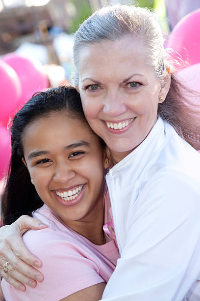 istock Close Women Hugging at Pink Awareness Rally 182773115