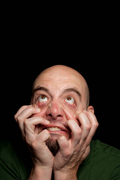 Sad woman with her hands over face.