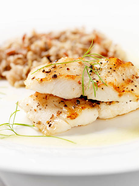 istock White Fish with Wild Rice & Garlic Butter Sauce 182773324