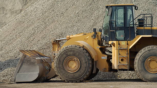 istock Earth Mover Gravel Pile 182773443