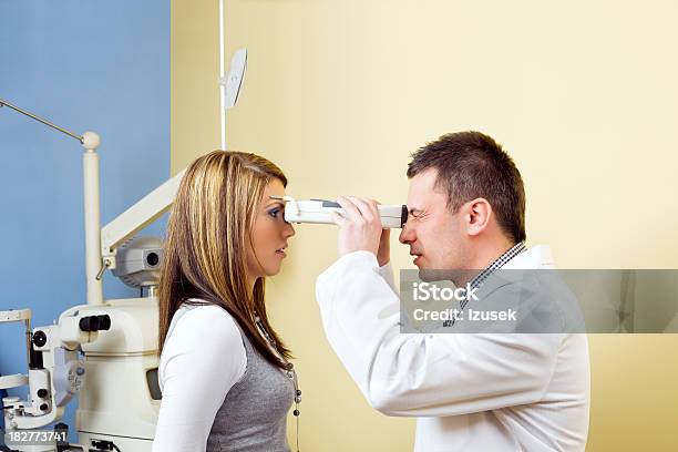 Optometrist Eye Exam Tonometer Stock Photo - Download Image Now - Patient, Adult, 25-29 Years