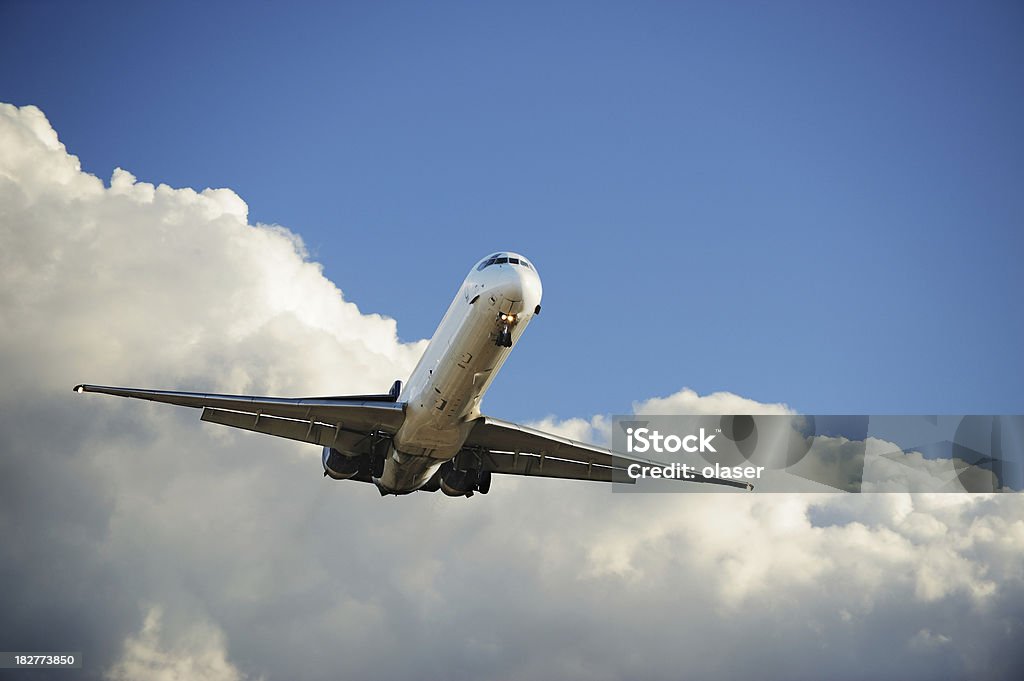 "I'm free", sunlit airplane taking off in bad weather "Commercial airliner leaves bad weather behind.Original background, not added/modified by post processing." Airplane Stock Photo