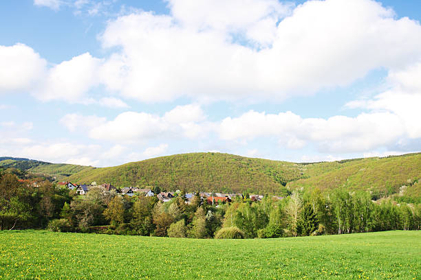 istock Small Village hidden in Hilly Landscape 182773939