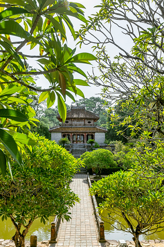 Minh Mang tomb near the Imperial City with the Purple Forbidden City within the Citadel in Hue, Vietnam. Imperial Royal Palace of Nguyen dynasty in Hue.